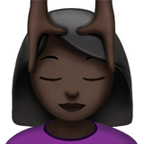 woman getting massage: dark skin tone Apple Emoji