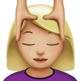 woman getting massage: medium-light skin tone Apple Emoji