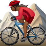 woman mountain biking: medium-dark skin tone